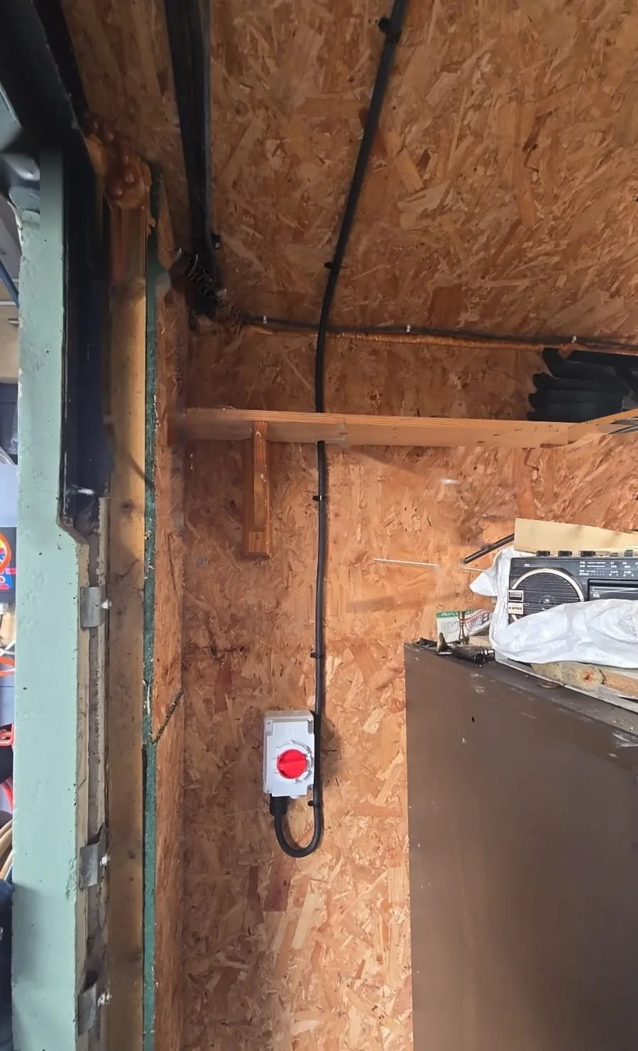Steel Wire Armoured (SWA) cable clipped to exterior wall