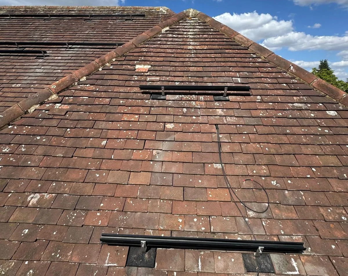Plain tile roof hooks anchored into rafters at Luton